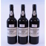 Three bottles of Cockburn's vintage port,