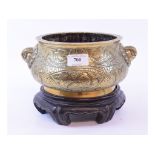 A Chinese bronze censer, with mask handles, decorated dragons, figures and other items,