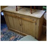 A pine two door cupboard, 112 cm wide, a pine drop leaf table, two pine cupboards and a stool,