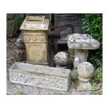 A set of three reconstituted stone spheres on stands, 24 cm wide, a chimney pot,