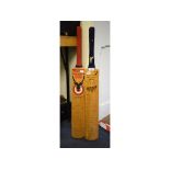 A cricket bat, signed by players from th