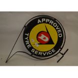 A circular double sided enamel sign, Dunlop Approved Tyre Service, with hanging bracket,