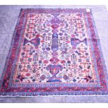 A Persian Afshar Rug, with motifs on a cream ground within a multi border,