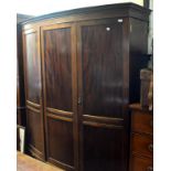 A late 19th century mahogany bow front three door wardrobe,