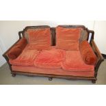 A bergere three piece suite, with single cane panels,