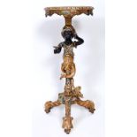 A painted and gilt torchere stand, with a Blackamoor figure support, 75.