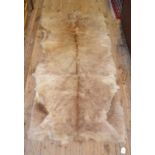 An animal hide rug,