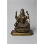 An Indian brass figure,