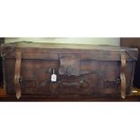 A large leather trunk, with wooden supports to base,