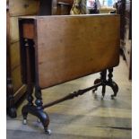 A Victorian walnut Sutherland table, on turned end supports,