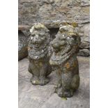 A pair of reconstituted stone lions,