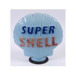 A Super Shell blue glass clam shell petrol pump globe, with rubber collar, some fading,