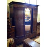 An Edwardian walnut wardrobe,