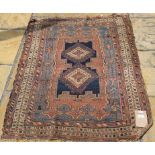 An Afshar rug, with stylised decoration, on a blue ground, within a multi border,