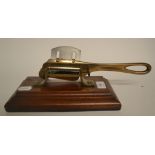 A mahogany and brass tabletop sugar cutter