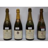 Two bottles of Bollinger Extra, a bottle of Marie Stuart, 1975,