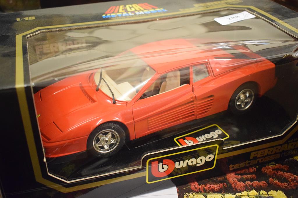 A Burago 1:18 scale model of a Ferrari Testarossa, six other similar models,