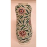 A Poole pottery vase, decorated flowers