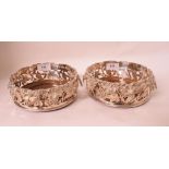 A pair of silver plated wine coasters (2