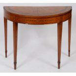 A D shape card table, veneered in satinwood and crossbanded in kingwood, inlaid scrolling flowers,