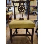 A George III mahogany dining chair, the crest rail carved flintlock muskets,