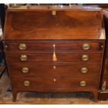 A George III mahogany bureau, the fall front revealing an inlaid interior,