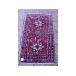 A Persian Heriz rug,