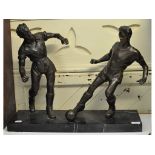 A large bronze group, of two football players, on a marble base, 61.