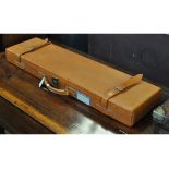 A Gunmark leather shotgun motoring case, to suit up to 30 inch barrels,