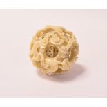 An ivory puzzle ball, damaged, 3.