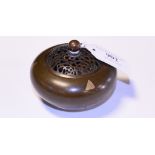 A bronze koro, with a pierced cover,