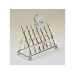 A silver plated gun toast rack