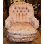 An upholstered button back nursing chair,