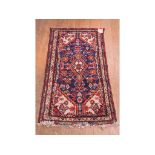 A Persian rug, 141 x 77 cm,