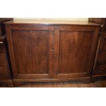 A 19th century oak linen press, having a pair of panel doors,