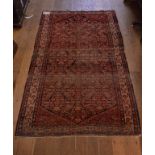 A Persian style rug, with a central medallion,