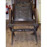 A pair of Glastonbury style oak armchairs,