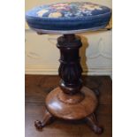 A 19th century rosewood screw adjustable piano stool,