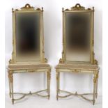 A pair of French painted and gilt wood console tables, with mirrors,