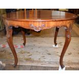 A Danish mahogany circular dining table, on carved cabriole legs, 110 cm wide,