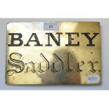 A brass door plate, inscribed BANEY Saddler,