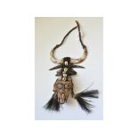 A Papua New Guinean Dayak Tribe Monkeyskull necklace,