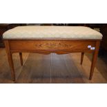 A late Victorian inlaid satinwood duet stool, with a box top and tapering square legs,