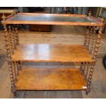 A Victorian walnut three tier whatnot, having a leather inset top, on barley twist supports,