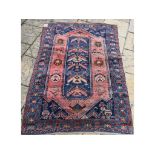 A Caucasian rug, with geometric motifs on a blue ground, within a multi border,