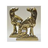 A pair of late 19th century brass door porters, in the form of dogs,