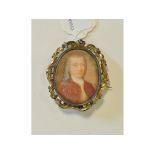 An oval portrait miniature, of a gentleman with grey ringlets, watercolour, 5.5 x 4.