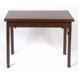 A late 18th century mahogany tea table, with blind fret carved decoration,