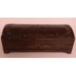 An Italian embossed dome top leather box, decorated putti,