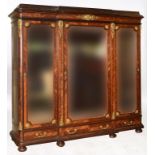 A French kingwood breakfront wardrobe, applied gilt metal mounts,